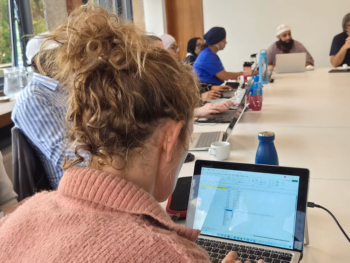 A learner practising AI skills on a laptop