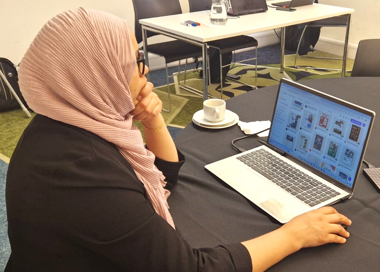 A learner using a laptop as part of a Smartlyte AI course session